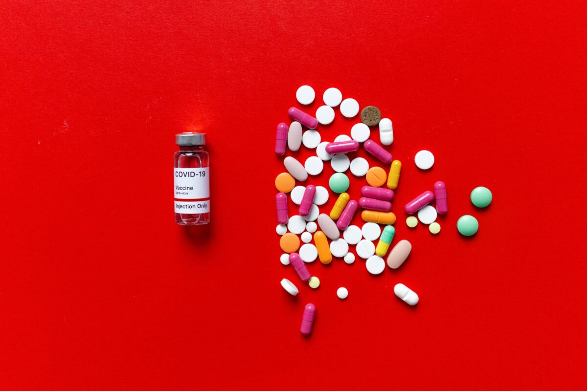 white and red labeled medication pill bottle