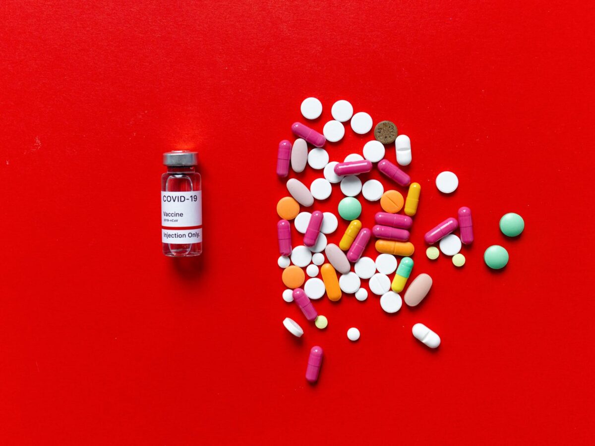 white and red labeled medication pill bottle